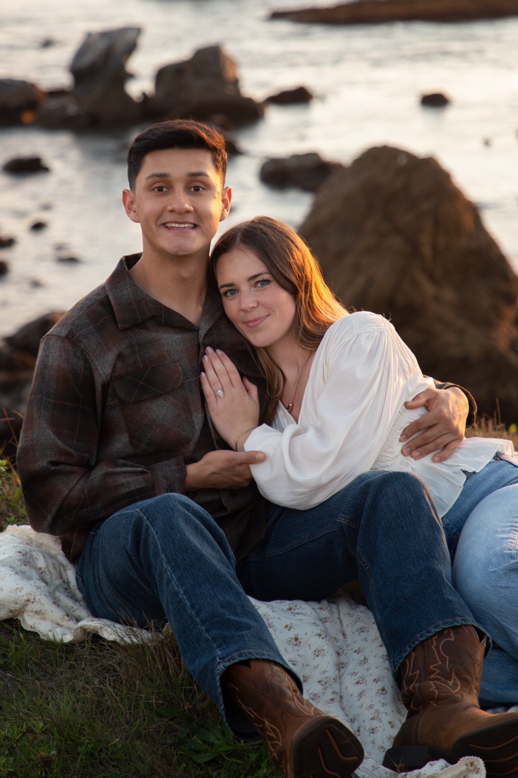Andy and Olivia together beside the ocean